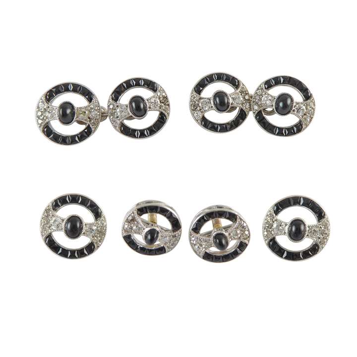 Early 20th century onyx and diamond dress set by Cartier, Paris c.1910, the set comprising a pair of cufflinks, two buttons and two studs, of openwork circular form,